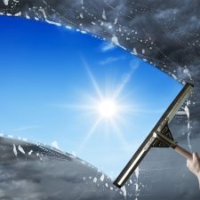 Squeegee washing dirty sky