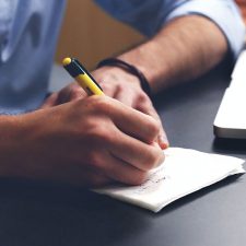 Property owner taking notes during interview with environmental consultant