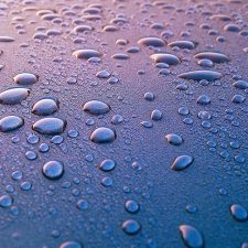 Water droplets on blue surface