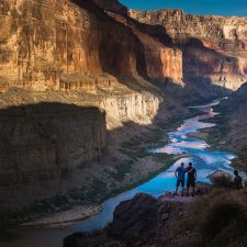 Three hikers make time for nature for 2020 World Environmental Day overlooking the Grand Canyon.