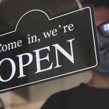 Drycleaner wearing mask opens store during the recession